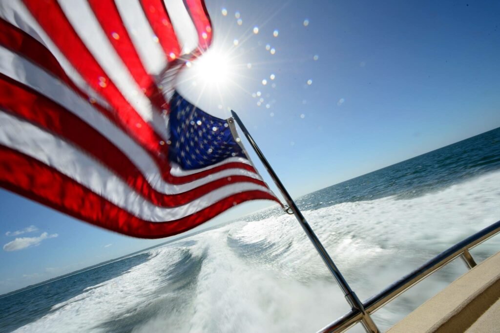 american flag waves on boat